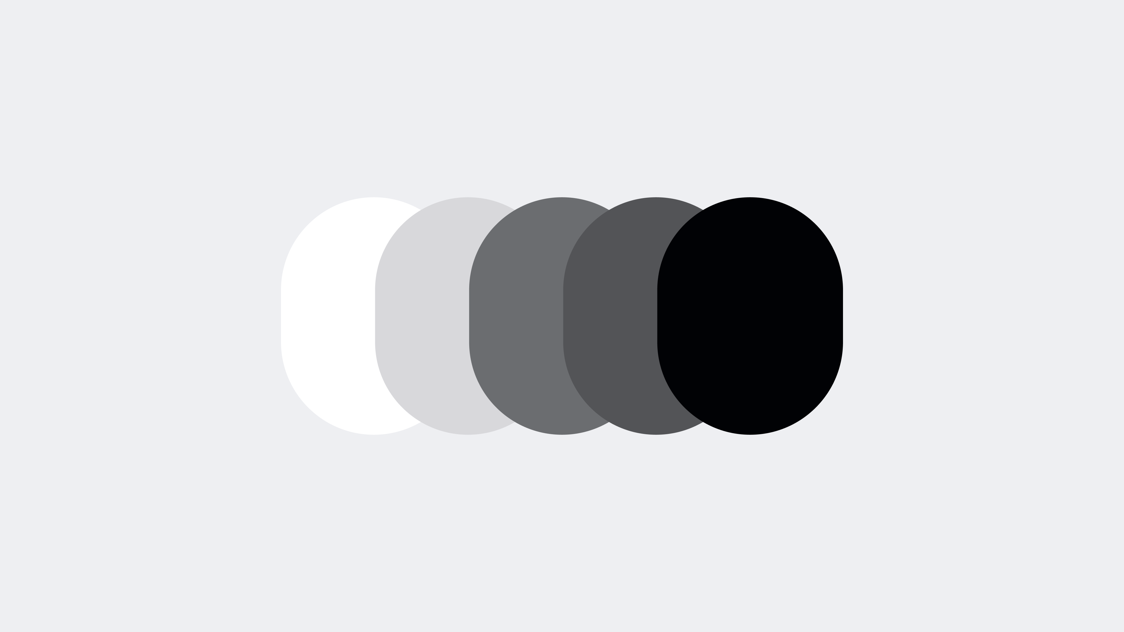 Five overlapping surfaces moving from white through grey tones to black